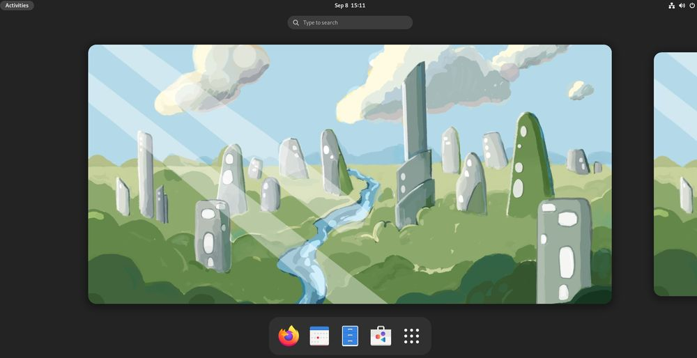 Fedora 37 屏幕截图，带有绿草、岩石冒充的建筑的油漆风格的壁纸，中间有一条河